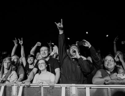 excited people in first row of concert