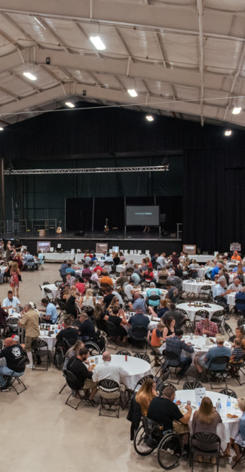 event with tables and stage in background