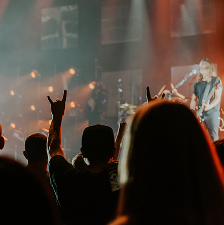 audience rocking out to band on stage