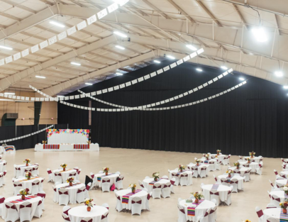 empty concert hall with lots of decorated tables