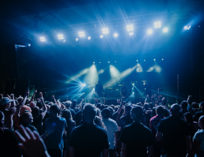 concert with lights on stage and audience